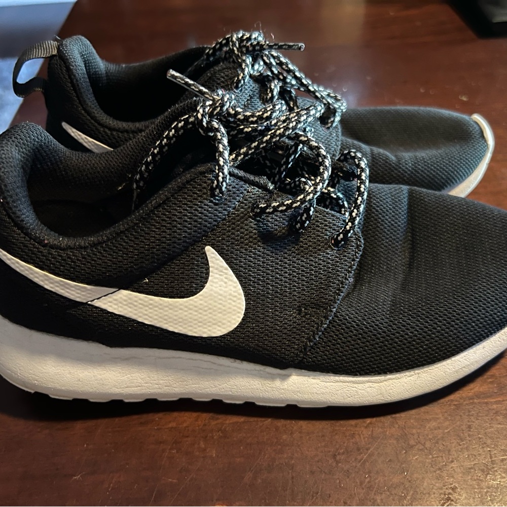 Nike black and white shoes.